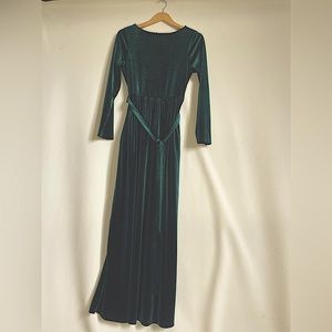 medium green velvet floor length dress with tie around middle and long sleeves